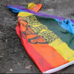 Pride flag thrown in the mud outside Anchorage Pride Prom, 23 Apr 2011